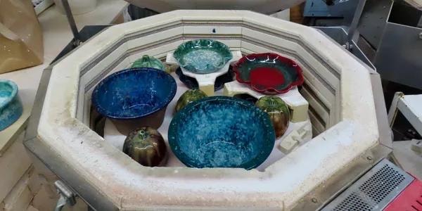 Glazed bowls inside the kiln after firing