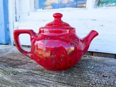 Vibrant red glazed ceramic teapot